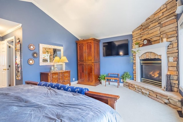 bedroom with carpet, a stone fireplace, lofted ceiling, and ornamental molding