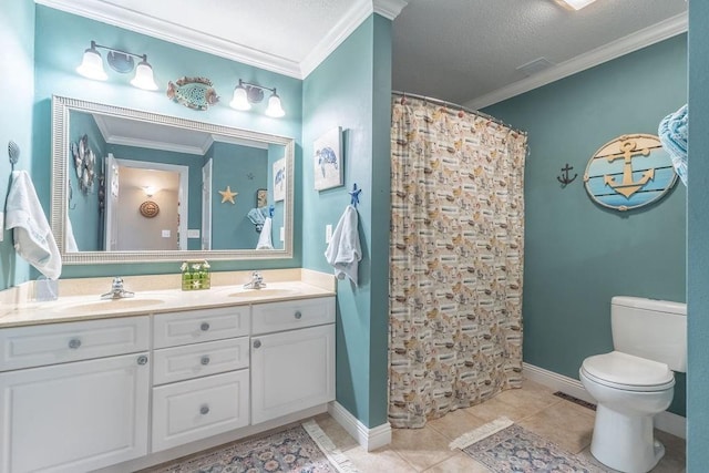 bathroom featuring tile patterned flooring, vanity, and crown molding