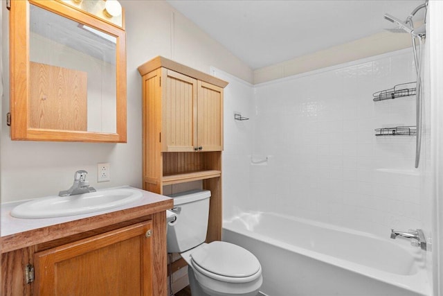 full bathroom with vanity, tiled shower / bath combo, and toilet