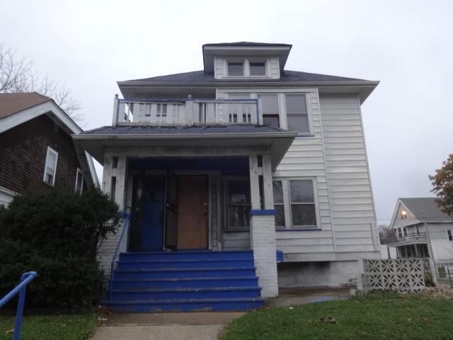 2977 N 26th St Unit 2979, Milwaukee, WI 53206 - american foursquare style home featuring a balcony and a porch