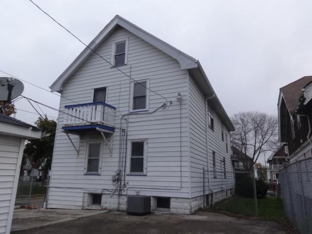 2977 N 26th St Unit 2979, Milwaukee, WI 53206 - rear view of house with central air condition unit and a balcony