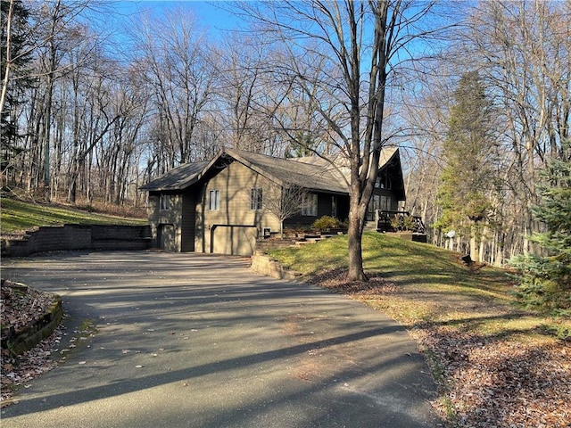 view of side of property featuring a garage