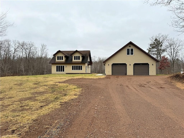 view of front of house with an outbuilding and a garage