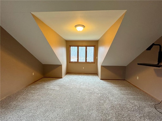 bonus room featuring light colored carpet