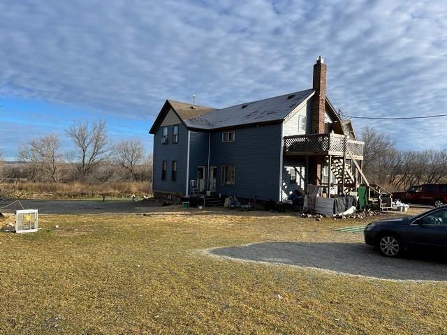 view of home's exterior with a lawn