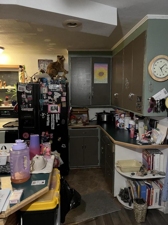 kitchen featuring black fridge with ice dispenser, dark hardwood / wood-style flooring, and crown molding