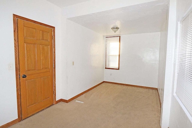 unfurnished bedroom with light carpet