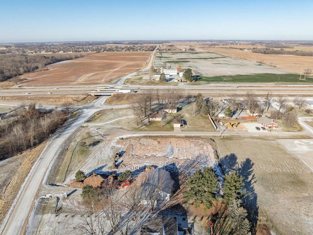 birds eye view of property featuring a rural view