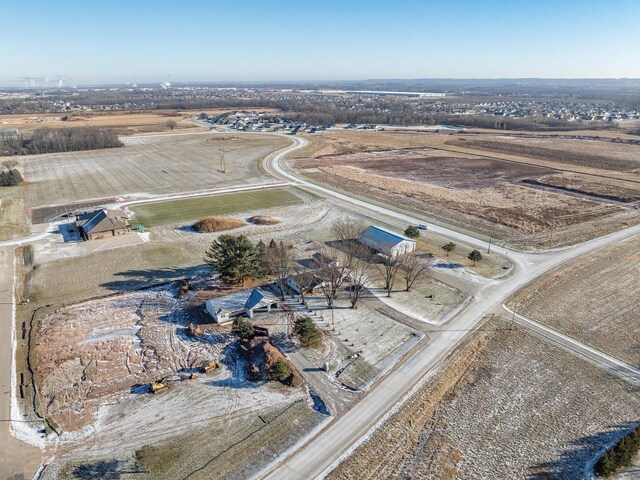 birds eye view of property with a rural view