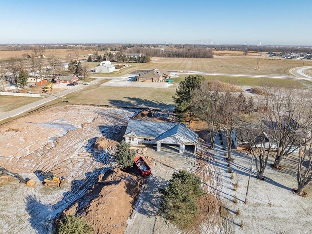 birds eye view of property with a rural view