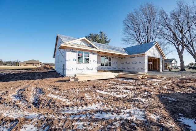 property in mid-construction featuring a garage and a porch