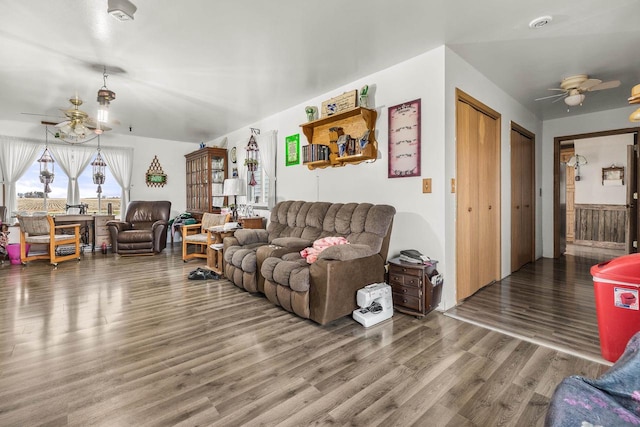 living room with ceiling fan and wood-type flooring