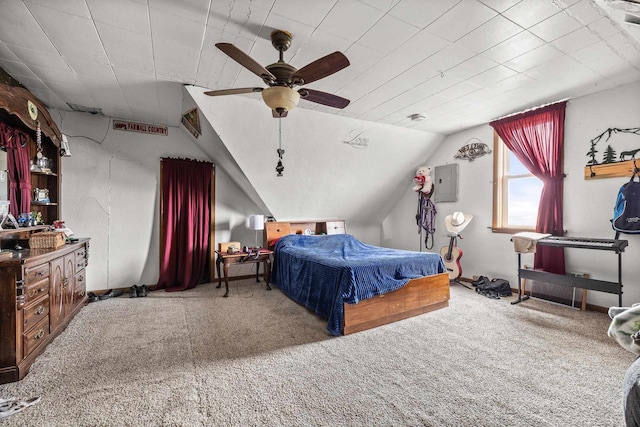 carpeted bedroom featuring ceiling fan, vaulted ceiling, and electric panel