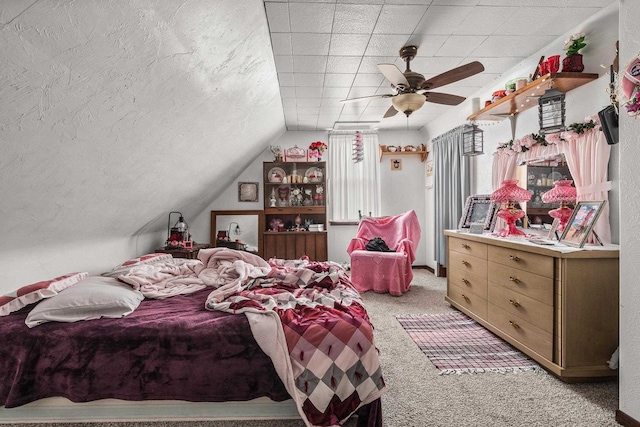 carpeted bedroom featuring ceiling fan and lofted ceiling