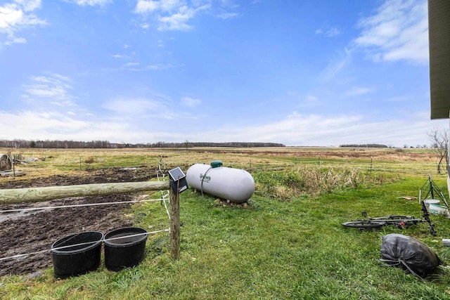 view of yard with a rural view