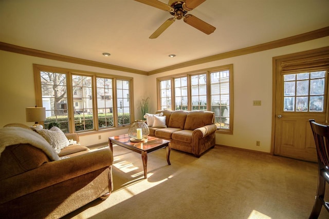 613 College St, Beloit, WI 53511 - living room with crown molding, baseboards, light carpet, and a ceiling fan