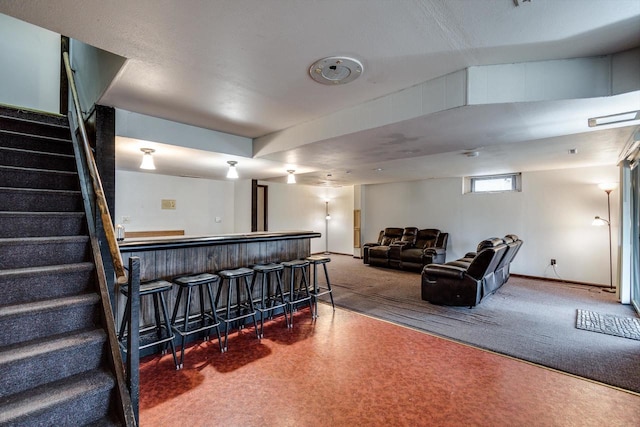 carpeted living room with indoor bar