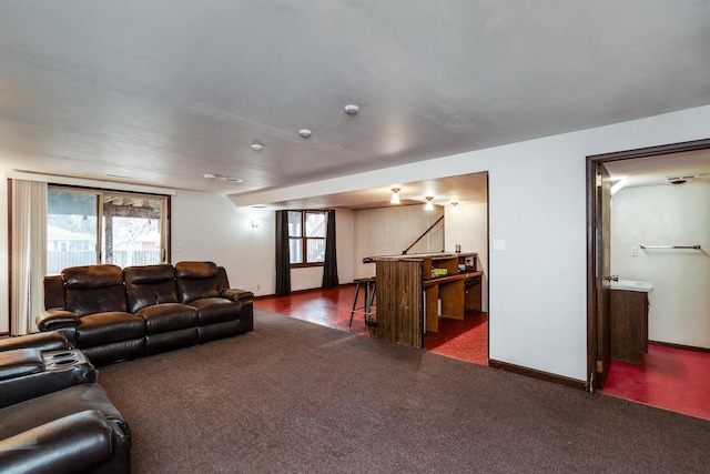 living room featuring dark colored carpet