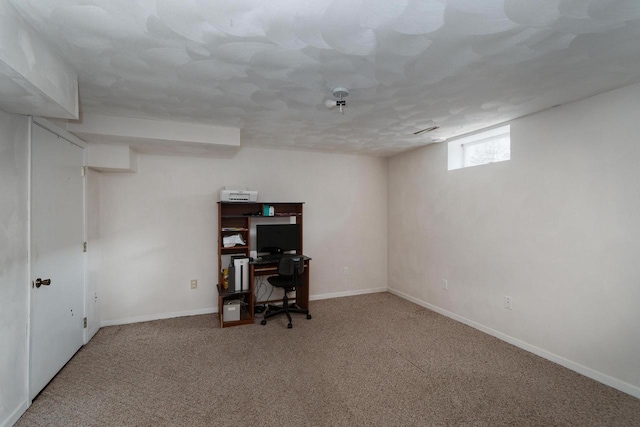 basement with carpet flooring