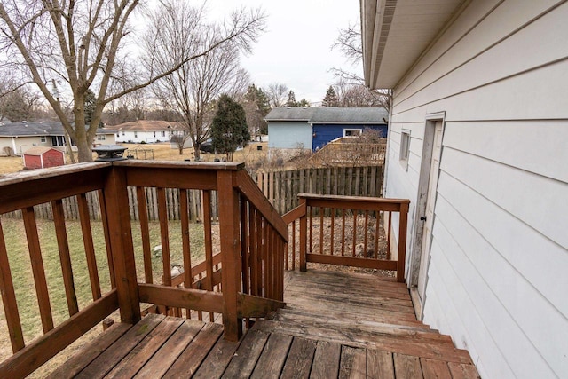 wooden deck featuring a yard