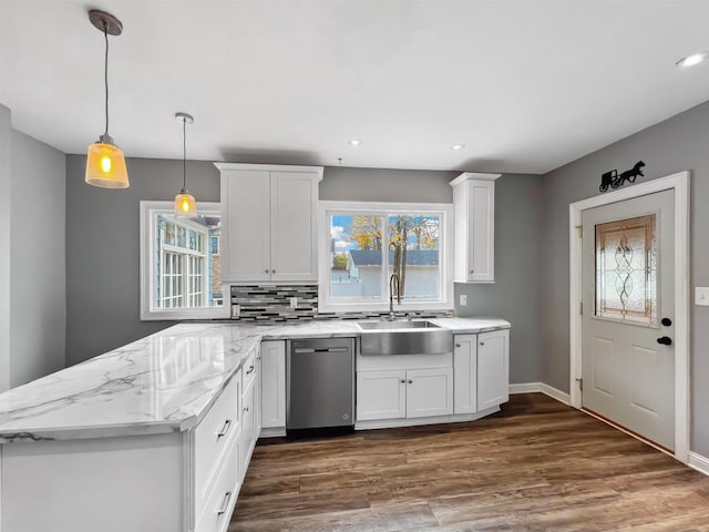 kitchen featuring dishwasher, white cabinets, dark hardwood / wood-style floors, and sink