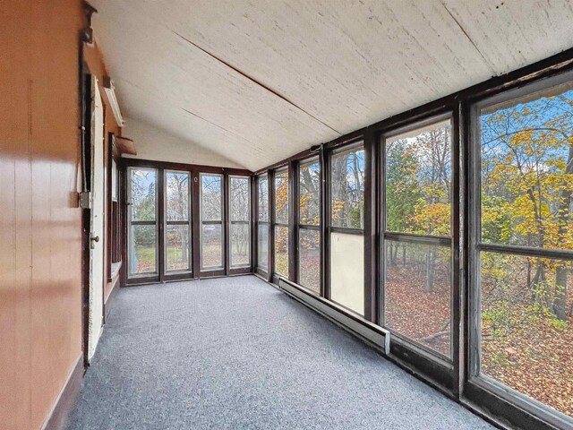unfurnished sunroom with plenty of natural light and vaulted ceiling