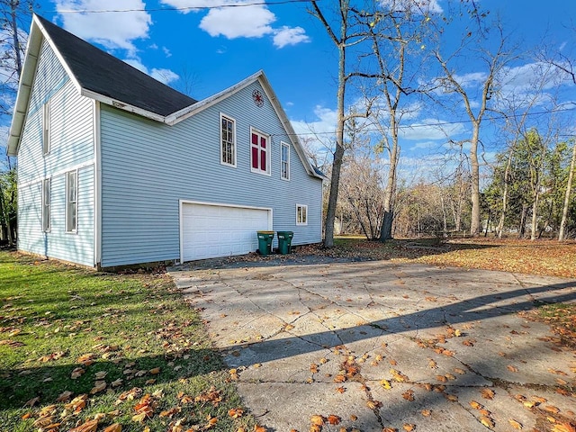 view of side of home featuring a garage
