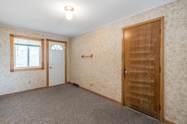 unfurnished room with carpet