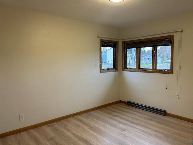 spare room featuring light wood-type flooring