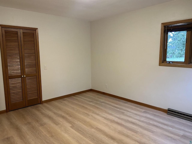 unfurnished bedroom with light hardwood / wood-style flooring