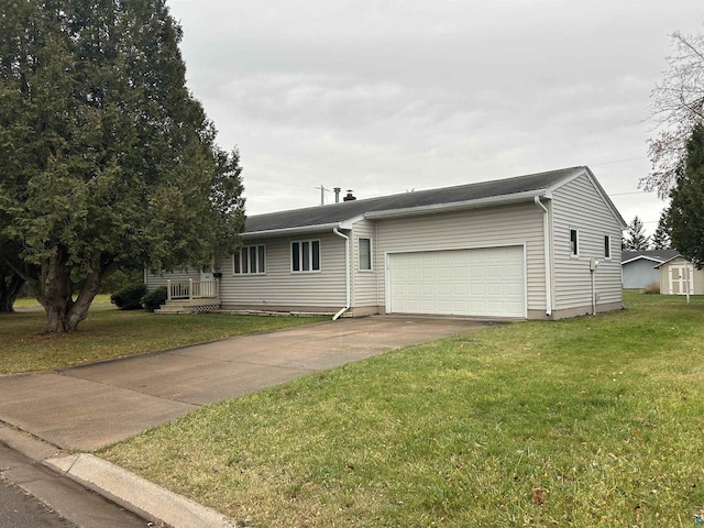 view of front of house with a front lawn and a garage