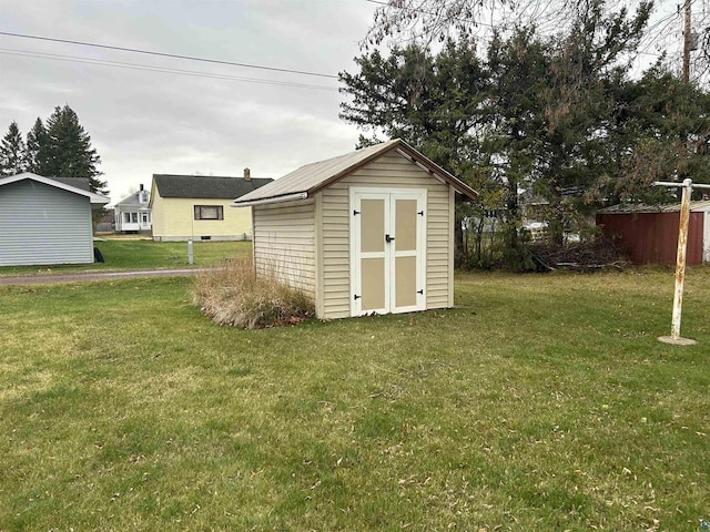 view of outdoor structure with a yard