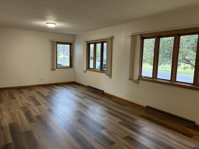 unfurnished room featuring dark hardwood / wood-style flooring