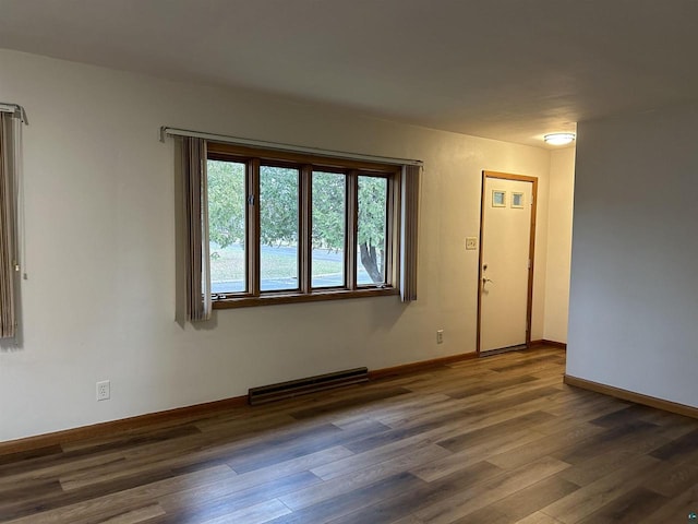 unfurnished room featuring dark hardwood / wood-style floors