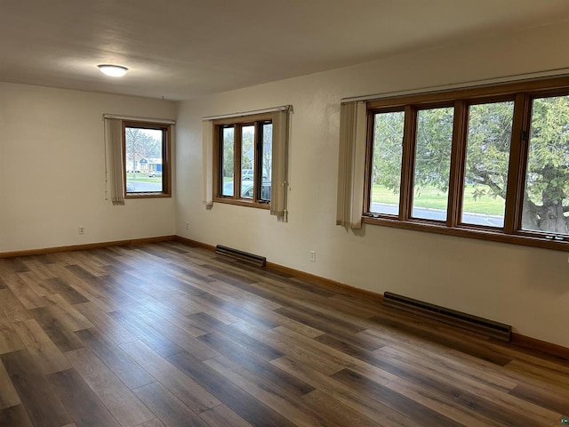 unfurnished room featuring dark wood-type flooring