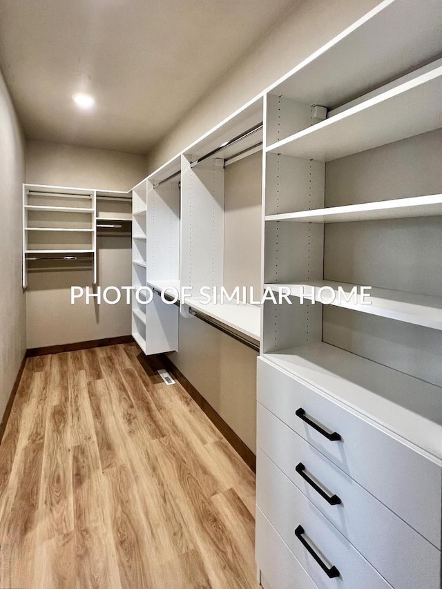 spacious closet with light wood-type flooring