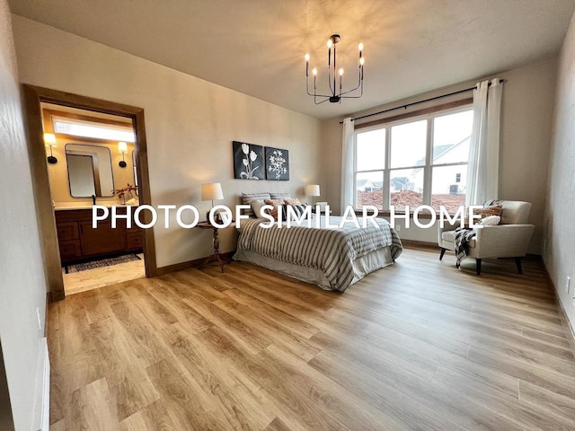 bedroom featuring baseboards, ensuite bathroom, light wood finished floors, and an inviting chandelier