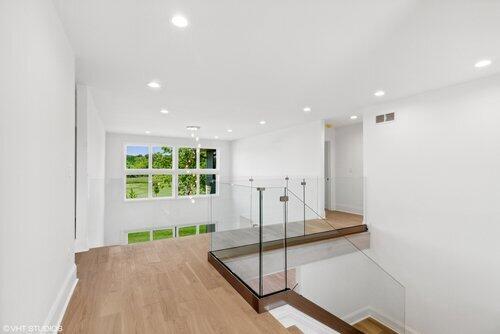 649 Eagleton Dr Unit 55-14, Lake Geneva, WI 53147 - hallway featuring wood finished floors, recessed lighting, and baseboards