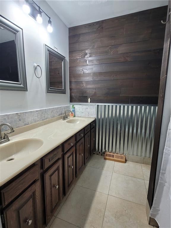 bathroom with tile patterned floors and vanity