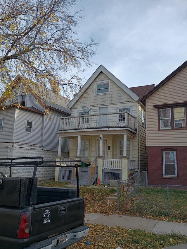 view of front of house featuring a porch and a balcony