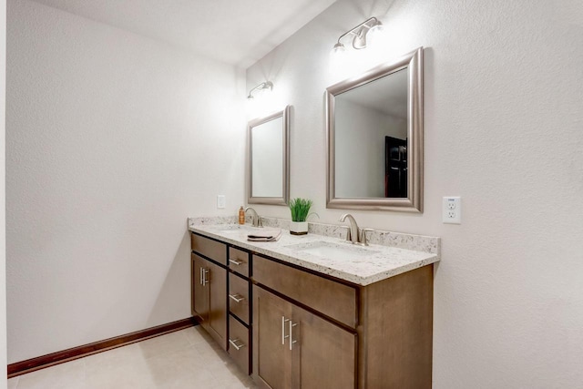 5240 Briarwood Cir, Racine, WI 53402 - bathroom with double vanity and baseboards