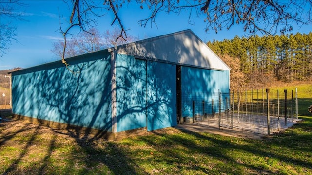 view of outbuilding featuring a lawn