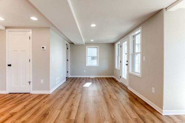 spare room with light wood-type flooring