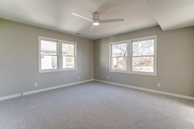 unfurnished room with ceiling fan and carpet floors