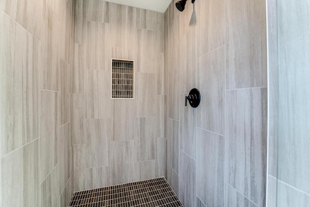 bathroom with tiled shower