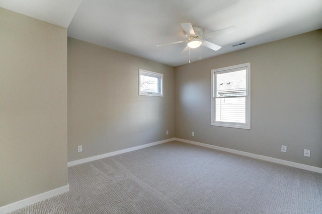 spare room with light carpet and ceiling fan