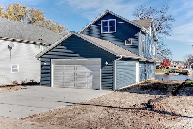 rear view of house with a garage