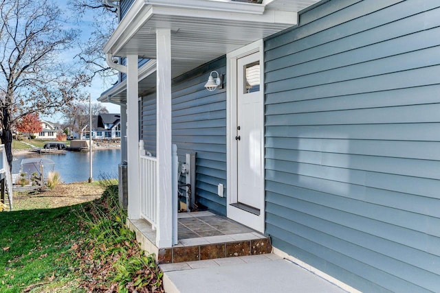 entrance to property with a water view