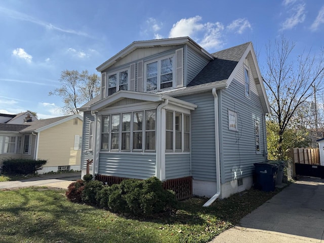 view of front of house with a sunroom