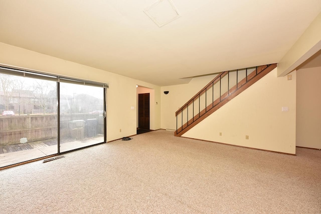 unfurnished living room with carpet